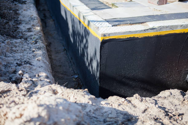 Professional Basement Waterproofing technician working in Spencer, NC